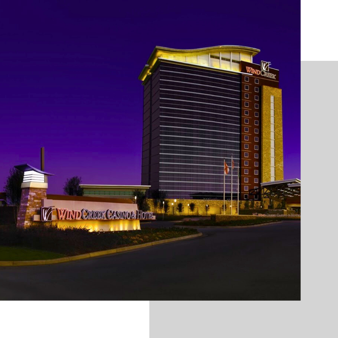 wind creek casino at dusk lit up with sign outside