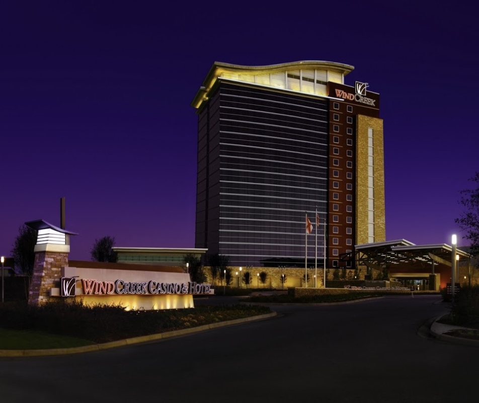 wind creek casino at dusk lit up with sign outside